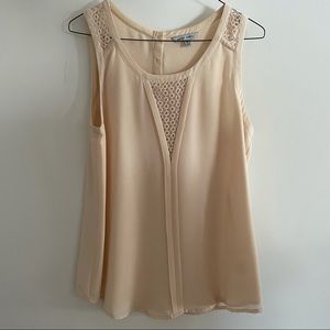 Flowy sleeveless blouse with crochet detail